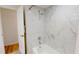 Bright bathroom featuring shower with marble style tiling and modern fixtures at 1849 Del Robles Dr, Clearwater, FL 33764