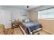 Cozy bedroom showcasing natural light, ceiling fan, and coordinated nautical decor at 1849 Del Robles Dr, Clearwater, FL 33764