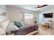 This bedroom is well-lit and features a ceiling fan and coordinated decor at 1849 Del Robles Dr, Clearwater, FL 33764