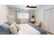 Bedroom with wood floors, neutral walls, ceiling fan and a small window at 1849 Del Robles Dr, Clearwater, FL 33764