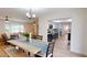 Dining area with hardwood floors that opens to living room and kitchen at 1849 Del Robles Dr, Clearwater, FL 33764