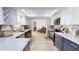 Bright kitchen features stainless steel appliances, custom cabinets and open floor plan at 1849 Del Robles Dr, Clearwater, FL 33764
