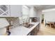 A cozy kitchen features stainless steel sink, modern faucet and lots of natural light at 1849 Del Robles Dr, Clearwater, FL 33764