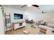 Spacious living room with modern decor, ceiling fans, and an open layout to the dining area at 1849 Del Robles Dr, Clearwater, FL 33764