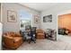 Bright home office with natural light, two chairs, desk, and stylish decor at 1910 E Palm Ave # 10109, Tampa, FL 33605