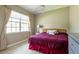 Bedroom featuring a large window with natural light, ceiling fan, and matching furnishings at 21012 Picasso Ct # 201, Land O Lakes, FL 34637