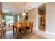 Inviting dining area with wood table and chairs, tile flooring, and natural light at 21012 Picasso Ct # 201, Land O Lakes, FL 34637