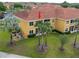 Exterior view of condo with lush landscaping and manicured lawn at 21012 Picasso Ct # 201, Land O Lakes, FL 34637