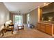 Bright living room with a sliding door to balcony, neutral walls, and carpeted floors at 21012 Picasso Ct # 201, Land O Lakes, FL 34637
