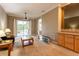 Bright living room with a sliding door to balcony, neutral walls, and carpeted floors at 21012 Picasso Ct # 201, Land O Lakes, FL 34637