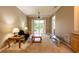 Bright living room with a sliding door to balcony, neutral walls, and carpeted floors at 21012 Picasso Ct # 201, Land O Lakes, FL 34637
