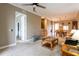 Open-concept living room and dining area with neutral carpet and lots of natural light at 21012 Picasso Ct # 201, Land O Lakes, FL 34637