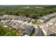 Overview of a residential neighborhood featuring modern homes and serene surroundings near a pond at 21590 Violet Periwinkle Dr, Land O Lakes, FL 34637