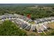 Aerial view showcases the home's location within a well-planned community, surrounded by lush greenery and other residences at 21590 Violet Periwinkle Dr, Land O Lakes, FL 34637