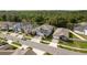 Residential street showcasing modern homes with landscaped lawns and tree lined streets at 21590 Violet Periwinkle Dr, Land O Lakes, FL 34637