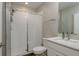 Bathroom with modern fixtures, a glass-enclosed shower, and a white vanity with a stone countertop at 21590 Violet Periwinkle Dr, Land O Lakes, FL 34637