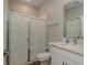This bathroom features a glass-door shower, white subway tile, and a white vanity at 21590 Violet Periwinkle Dr, Land O Lakes, FL 34637
