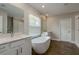 Bright bathroom featuring double vanity, soaking tub, and shower at 21590 Violet Periwinkle Dr, Land O Lakes, FL 34637