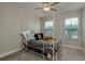 bedroom featuring a unique carriage bed, ceiling fan, and natural light from the windows at 21590 Violet Periwinkle Dr, Land O Lakes, FL 34637