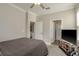 Bedroom with a bed, carpeted floor, and doorways leading to the bathroom and other rooms at 21590 Violet Periwinkle Dr, Land O Lakes, FL 34637