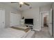 Clean bedroom with carpet, a ceiling fan, closet, TV, and connected bathroom at 21590 Violet Periwinkle Dr, Land O Lakes, FL 34637