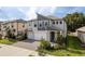 Contemporary two-story home with a two-car garage and modern architectural details at 21590 Violet Periwinkle Dr, Land O Lakes, FL 34637