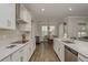 Bright kitchen with stainless steel appliances, quartz countertops, and an adjacent dining area at 21590 Violet Periwinkle Dr, Land O Lakes, FL 34637