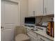 Home office space with built in desk and chair with neutral colors at 21590 Violet Periwinkle Dr, Land O Lakes, FL 34637