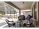 Enclosed patio features an outdoor seating area, patio furniture, grill, and string lights at 21590 Violet Periwinkle Dr, Land O Lakes, FL 34637