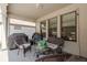 Enclosed patio features an outdoor seating area, patio furniture, and privacy with string lights at 21590 Violet Periwinkle Dr, Land O Lakes, FL 34637