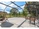 Enclosed patio features an outdoor seating area and furniture, perfect for entertaining at 21590 Violet Periwinkle Dr, Land O Lakes, FL 34637