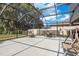 Enclosed patio features an outdoor seating area and furniture, perfect for entertaining friends and Gathering at 21590 Violet Periwinkle Dr, Land O Lakes, FL 34637