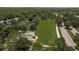 Spacious community playground with modern equipment, protective sunshades, and a large open field at 21590 Violet Periwinkle Dr, Land O Lakes, FL 34637