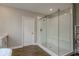 Bright bathroom featuring a glass shower, white tile and vanity at 21590 Violet Periwinkle Dr, Land O Lakes, FL 34637