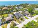 Panoramic aerial view of a single-Gathering home with a waterfront view nestled in a lush neighborhood at 219 Miramar Ne Blvd, St Petersburg, FL 33704