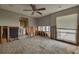 Spacious bedroom featuring a ceiling fan, window with blinds, and exposed wall framing at 219 Miramar Ne Blvd, St Petersburg, FL 33704