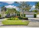 Charming single-Gathering home with mature landscaping, a well-manicured lawn, and a two-car garage at 219 Miramar Ne Blvd, St Petersburg, FL 33704
