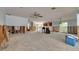 Spacious living room featuring a ceiling fan, bright window, and potential for customization at 219 Miramar Ne Blvd, St Petersburg, FL 33704