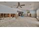 Large living area showing open-concept design with bright natural light and fan at 219 Miramar Ne Blvd, St Petersburg, FL 33704