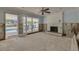 Living room with an inviting fireplace and access to the outdoor pool area at 219 Miramar Ne Blvd, St Petersburg, FL 33704