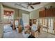 Room featuring cabinets, a window with blinds, exposed framing, and boxes at 219 Miramar Ne Blvd, St Petersburg, FL 33704