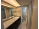 Well-lit bathroom featuring granite countertops and tile flooring at 229 Mary Dr # 229, Oldsmar, FL 34677