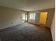 Bright bedroom with carpeted floors and a screened patio at 229 Mary Dr # 229, Oldsmar, FL 34677