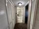 Hallway with access to bathroom and bedroom closets at 229 Mary Dr # 229, Oldsmar, FL 34677