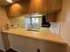 Kitchen pass-through features ample counter space and a convenient breakfast bar for casual dining at 229 Mary Dr # 229, Oldsmar, FL 34677