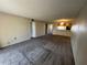 Open-concept living area with plush carpeting and seamlessly connected to the kitchen for easy living at 229 Mary Dr # 229, Oldsmar, FL 34677