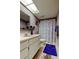 Functional bathroom with a vintage pink sink, a patterned shower curtain, and lilac-colored walls at 2600 Forest Run Ct, Clearwater, FL 33761