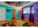 Fun bedroom features bright walls, modern accents, wood floors and vibrant area rug at 2600 Forest Run Ct, Clearwater, FL 33761