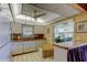 Eat-in kitchen featuring bright lighting, white cabinetry, and laminate counters at 2600 Forest Run Ct, Clearwater, FL 33761