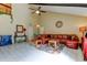 Comfortable living room with vaulted ceiling, fan, and ample seating at 2600 Forest Run Ct, Clearwater, FL 33761